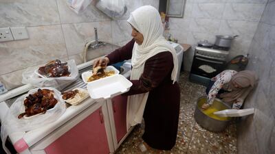 Iraqi Ikhlas Majeed prepares iftar meals for worshipers and poor families in Baghdad's Adhamiya district, Iraq. Reuters