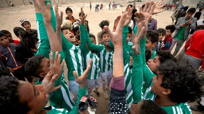 Young Yemeni players celebrate after winning a soccer competition at a neighborhood in Sanaa, Yemen. EPA