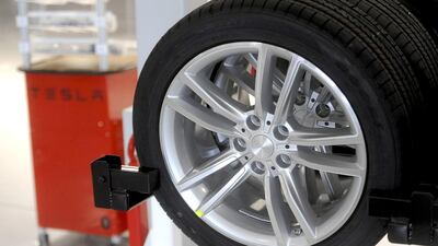 A Model S wheel awaits installation at Tesla’s factory in California. Investors are expecting the electric carmaker to post favourable sales in China and Europe. Noah Berger / Reuters