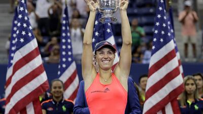 Angelique Kerber, of Germany, holds up the championship trophy after beating Karolina Pliskova. Darron Cummings / AP Photo