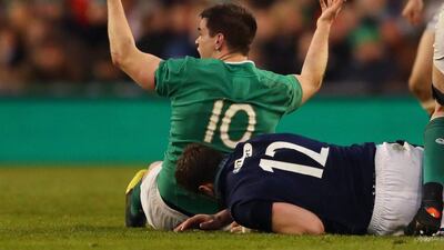 Jonathan Sexton of Ireland reacts after being "tip tackled" by Alex Dunbar of Scotland during the RBS Six Nations match between Ireland and Scotland at the Aviva Stadium on March 19, 2016 in Dublin, Ireland. (Photo by Richard Heathcote/Getty Images)