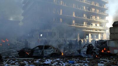 Cars burn on the site of an explosion in Beirut 14 Feruary 2005. Fomer Lebanese Prime Minister Rafiq Hariri was killed in the huge explosion in central Beirut. AFP PHOTO/ANWAR AMRO / AFP PHOTO / ANWAR AMRO