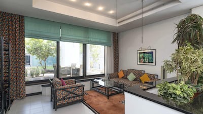 White walls and floors are prominent throughout the villa.