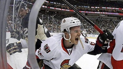Pittsburgh Penguins enforcer Matt Cooke, left, says he had no intention of injuring Ottawa Senators defenseman Erik Karlsson, but Karlsson is now out indefinitely after one of Cooke's skates cut an achilles tendon on Karlsson.