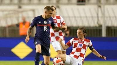France's Lucas Digne, left, duels for the ball with Croatia's Luka Modric. AP Photo