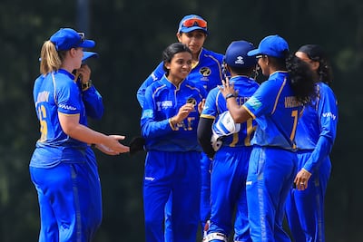 Simran Sheth, centre, celebrates taking her first wicket in international cricket, aged 15. Courtesy ACC