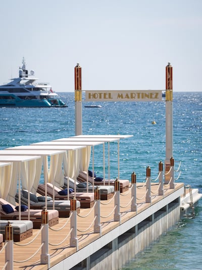 A sun lounger-lined pier that stretches into the Bay of Cannes. Photo: Arnold Jerocki