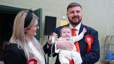 Labour candidate Chris Webb celebrates with his wife Portia and baby Cillian after winning the Blackpool South by-election. PA