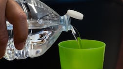 In the UAE, plastic bottle tops could soon be tethered to bottles to reduce pollution. AFP