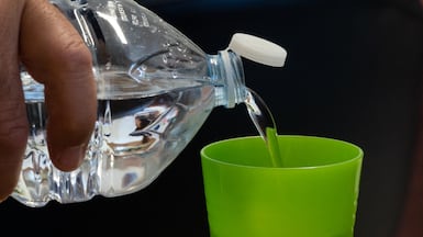 In the UAE, plastic bottle tops could soon be tethered to bottles to reduce pollution. AFP