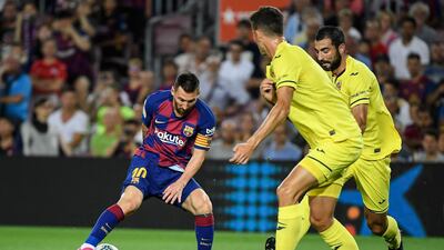 Barcelona's Argentine forward Lionel Messi vies with Villarreal's Spanish defender Raul Albiol. AFP