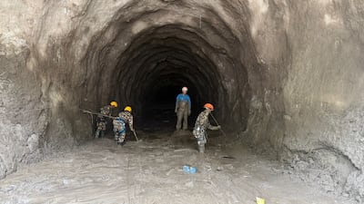 Rescue workers clear the way in a hydropower tunnel in Nepal, as they search for survivors after deadly flash floods. Reuters