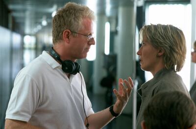 Curtis directing Emma Thompson in 'Love, Actually'. Shutterstock.