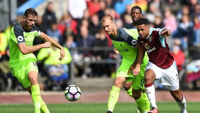Burnley's Andre Gray, right, and Liverpool's Ragnar Klavan battle for the ball during their Premier League match at Turf Moor, Burnley, England, Saturday, August 20, 2016. Anthony Devlin / AP Photo