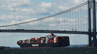 A fully loaded cargo ship heads out to sea from New York Harbor. Donald Trump’s economic policies include strengthening trade barriers. Spencer Platt / AFP