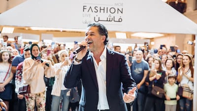 Ragheb Alama sings as part of the MOE Fashion Live runway shows. Mall of the Emirates