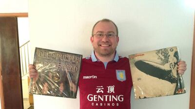 Jonathan Turner from the UK with his albums by Deep Purple and Led Zeppelin and wearing his Aston villa football top. Courtesy Jessica Hill