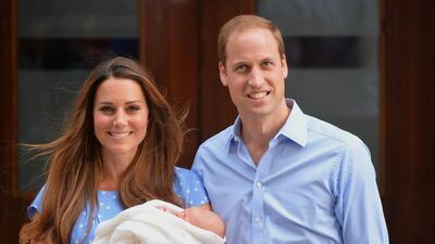 File picture of Prince William and Catherine, Duchess of Cambridge holding their then newborn baby Prince George outside the Lindo Wing of St Mary’s Hospital in London on July 23, 2013. Leon Neal / AFP Photo