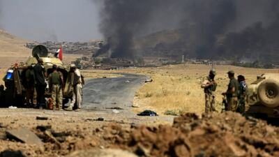 Smoke rises from clashes during the war between Iraqi army and Shiite Popular Mobilisation Forces against the ISIL militants in Al Ayadiya, north-west of Tal Afar, Iraq on August 28, 2017. Thaier Al Sudani/Reuters