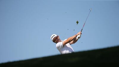 Andy Sullivan of England plays a shot during the final round of the 2016 Dubai Desert Classic at the Emirates Golf Club in Dubai on February 7, 2016. AFP / KARIM SAHIB