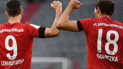 Bayern Munich's Leon Goretzka celebrates scoring the opening goal with Robert Lewandowski on Saturday. AFP