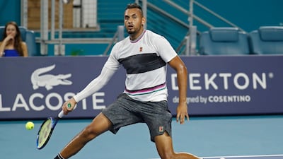 Nick Kyrgios with a no-look volley during his Miami Open match against Dusan Lajovic. Reuters
