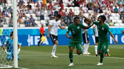 Saudi Arabia's Salem Al Dawsari, centre, celebrates his winning goal. Darko Vojinovic / AP Photo
