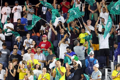 Saudi fans watch their team play at Neom Beach soccer club
