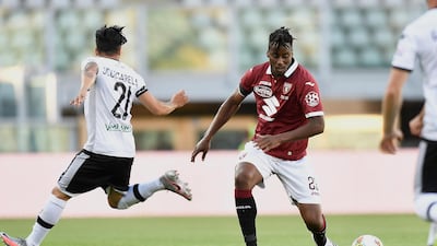 Torino's Soualiho Meite goes for the ball ahead of Parma's Matteo Scozzarella. AP Photo