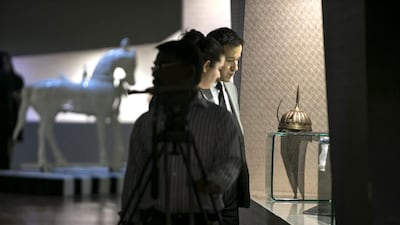 A visitor peruses the objects on display at the 99,000 square-meter art gallery. Silvia Razgova / The National