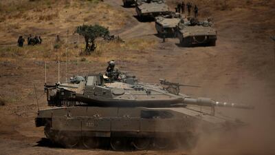 Israeli military tanks drill near Kibbutz Merom Golan in the Golan Heights. AFP
