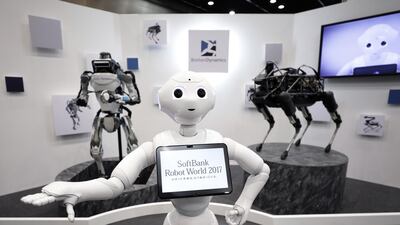 Pepper the humanoid robot on display at SoftBank Robot World in Tokyo, Japan, this week. The organisers envisage a future where one trillion devices are connected to the internet and technology is integrated into humans / Bloomberg