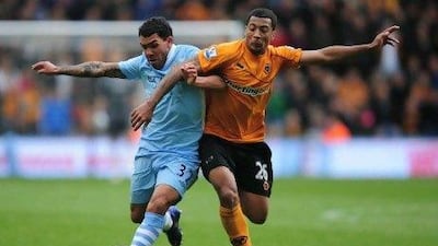Carlos Tevez, left, missed most of the season for Manchester City before returning to net four times in his last three games. Jamie McDonald / Getty Images