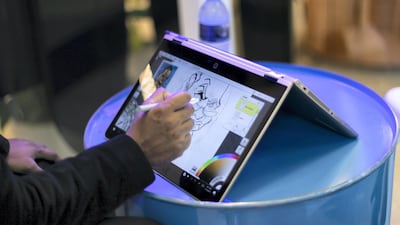 A cartoonist draws a digital caricature