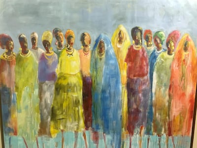 A painting by Almogera Abdulbagey shows female protesters during the uprising that toppled dictator Omar Al Bashir in April last year. Hamza Hendawi for The National