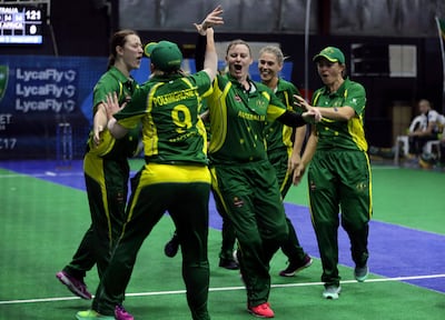 Australia's women players celebrate after scoring a point against South Africa during the women's final. Kamran Jebreili / AP Photo