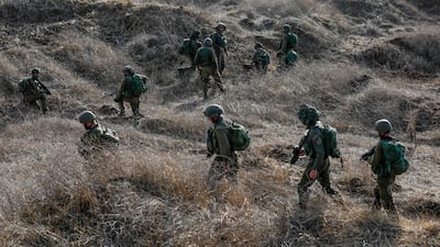 Israeli soldiers take part in an military exercise near Kibbutz Ortal in the Israel-annexed Golan Heights near the Lebanon border on November 15, 2023, amid increasing cross-border tensions as fighting continues with Hamas militants in the southern Gaza Strip. AFP