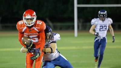 The Dubai Barracudas, in white and blue, were not able to stop the Dubai Stallions in the EAFL title game last night. Victor Besa for The National