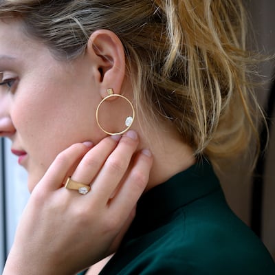 Floating diamond hoop earrings and off-set diamond ring by Nuun Jewels. Photo: Princess Nourah Al Faisal