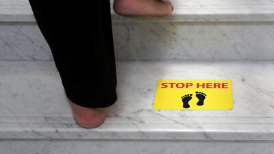Safe distance marking stickers placed on the floor at Gurunanak Darbar in Jebel Ali, Dubai. Pawan Singh / The National