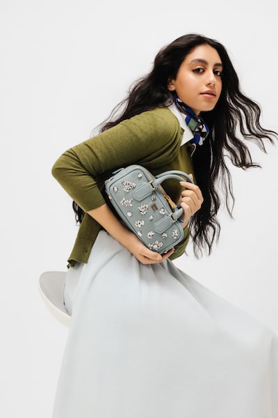 Cashmere and silk cardigan; cashmere crew-neck sweater; chambray midi-skirt; printed silk scarf, silk socks; leather belt; and Arcadie embroidered nappa leather bag, all from Miu Miu