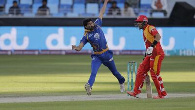 Sohail Tanver ( Karachi Kings ) bowls against Islamabad United, also seen is Misbah Ul Haq ( Islamabad United )at their ongoing HBL Pakistan Super League cricket tournament, held at the Dubai International Cricket Stadium. ( Jeffrey E Biteng / The National )