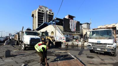 Iraqi anti-riot police forces remove tents of protesters from the Tahrir Square in central Baghdad. EPA