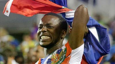 A fan cheers after Haiti scored its only goal against Brazil, during the second half of a Copa America group B soccer match Wednesday, June 8, 2016, in Orlando, Fla. Brazil won 7-1. (AP Photo/John Raoux)