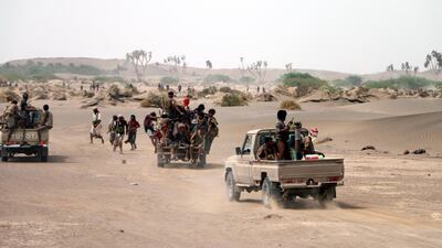 Yemeni government forces backed by the Saudi-led coalition take position during an attack to liberate the port city of Hodeidah. Najeeb Almahboobi / EPA