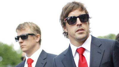 Ferrari drivers Fernando Alonso, right, and Kimi Raikkonen, left, are third and 12th in the F1 drivers' standings, respectively. Alessandro Garofalo / Reuters