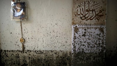 Mud is splattered across a wall in the flood-damaged home of the Kovacevic family in Topcic Polje. More than 50 people were killed by flooding and landslides in Serbia, Bosnia and Croatia. The heaviest rainfall in more than a century had caused rivers to burst their banks, sweeping away roads, bridges and homes. Dado Ruvic / Reuters