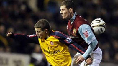 Burnley's Chris McCann keeps a close check on Arsenal's Jack Wilshere during their League Cup encounter at Turf Moor.