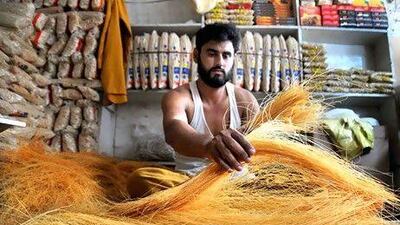 A Pakistani vendor packs vermicelli a traditional food cooked in sweet milk, ahead of Eid al-Fitr festival marking the end of Ramadan, in Peshawar, Pakistan.