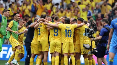 Players of Romania celebrate after the match. EPA